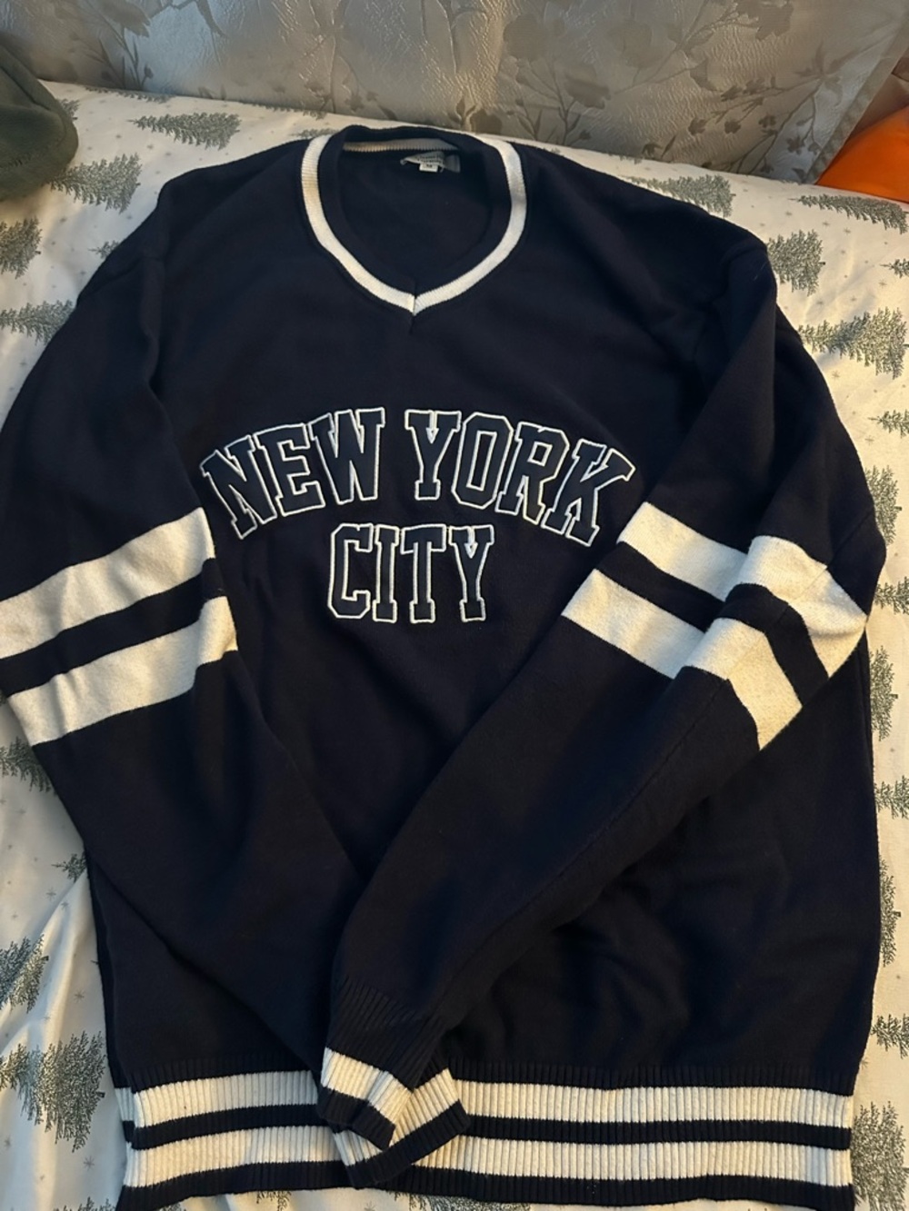 Navy V-Neck Sweater with White Stripes and 'New York City' Lettering